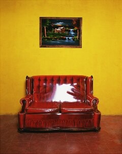 Joaquin Trujillo & Brian Paumier red couch photograph